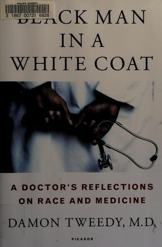 Black man in a white coat