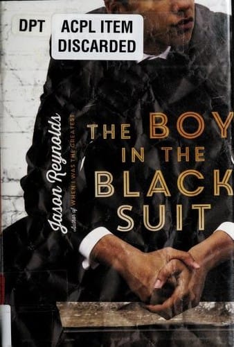 The boy in the black suit